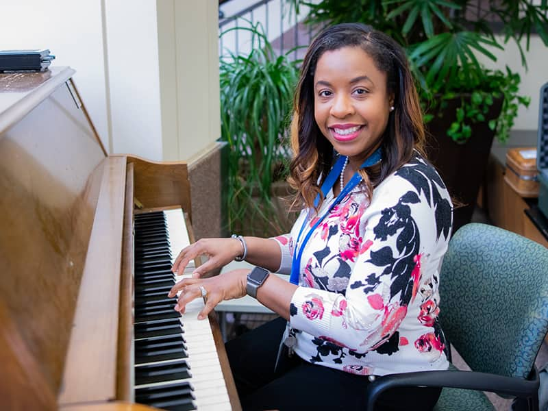 Dr. Mason-Bolden Playing the Piano at Healing Arts Event